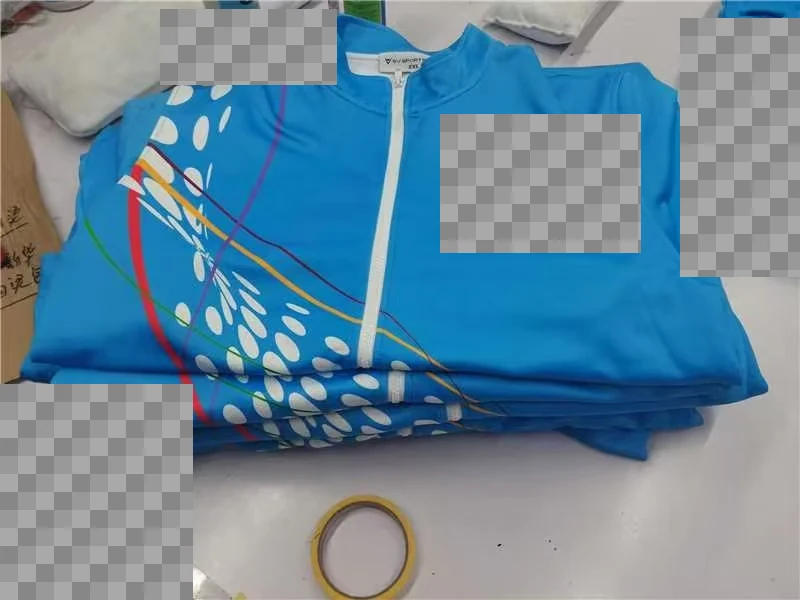 Folded printed zip jackets; customer lettering and labels are obscured.