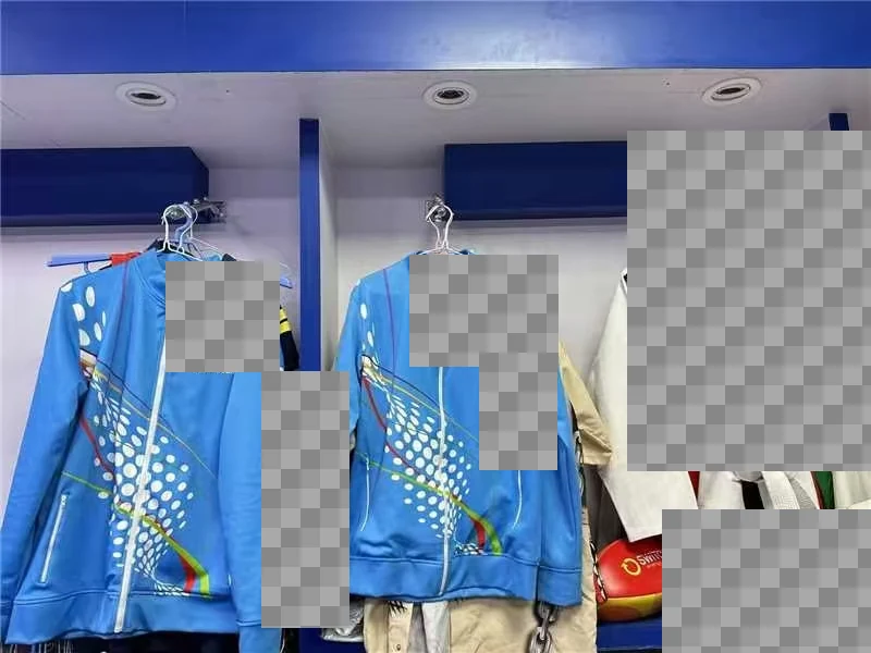 Zip jackets and garments displayed on hangers, with customer identifiers obscured.